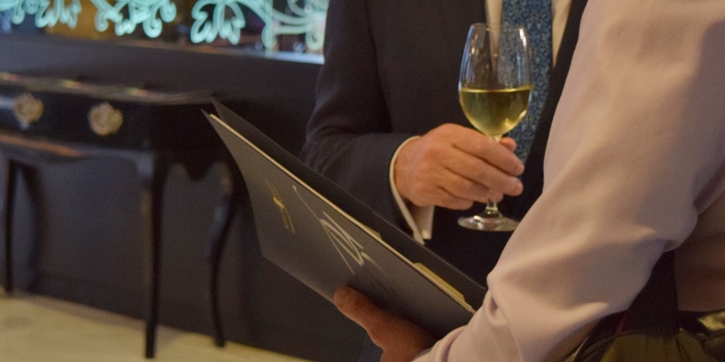 Partial view of two people talking at one of Blevins Franks' seminars