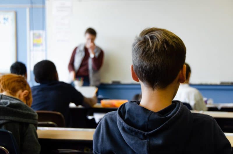 boy-sitting-in-classrom-scaled-800x530