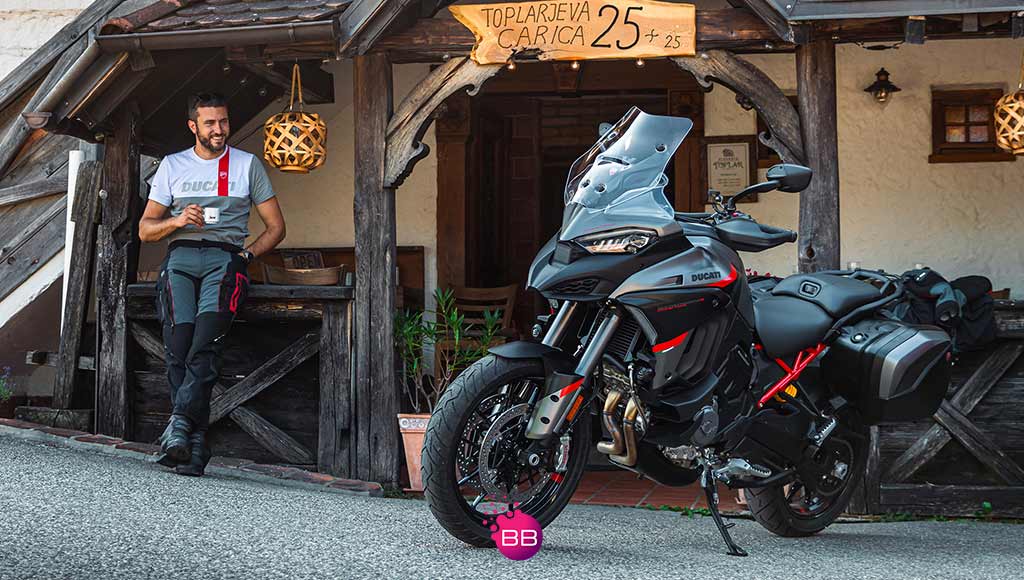 A man sitting next to a Ducati Multistrada V4S Grand Tour like the ones available at the newly set Ducati Faro centre.|ducati-2-sep-2024|A person riding a Ducati Panigale like the ones available at the newly set Ducati Faro centre.
