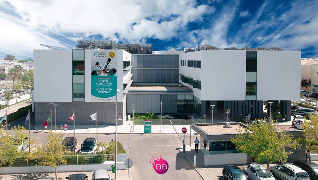 Photo of the outside of HPA Health Group Gambelas unit|Photo of a surgical team in an operating room at one of HPA Health Group's hospitals|HPA Health Group's hospitals|A hospital rooms at of HPA Health Group's units|Hospital Particular do Algarve Group – technological innovation in health care