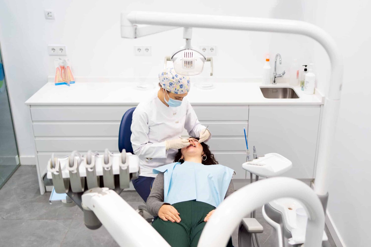 Cleaning treatment for a woman in a dental clinic