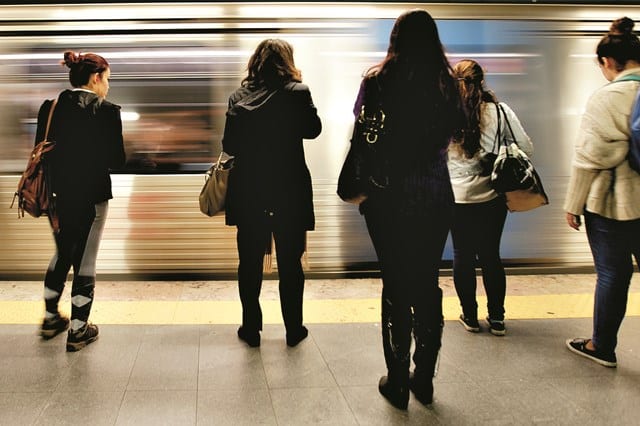 people waiting for subway|group of people
