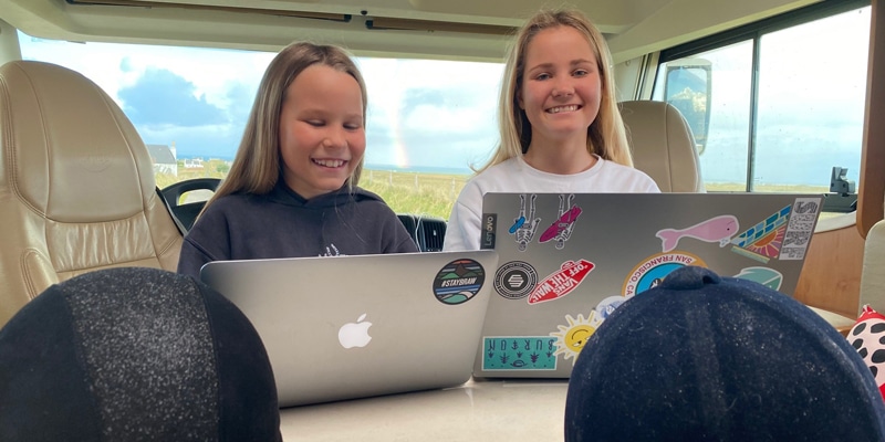 Students from InterHigh School studying in a camper van