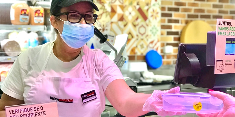 Customer using her own packaging at Intermarché Lagos