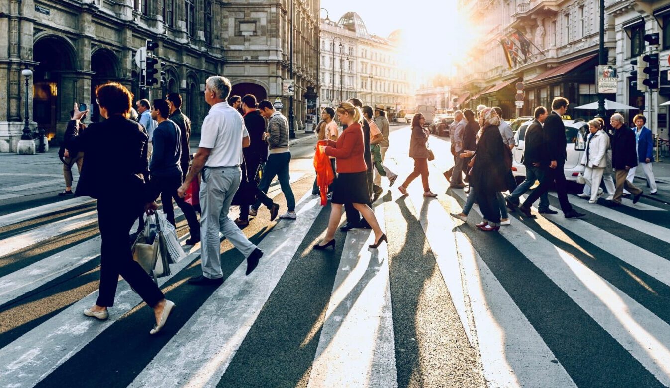 people walking across zebra crossing|Eleições antecipadas