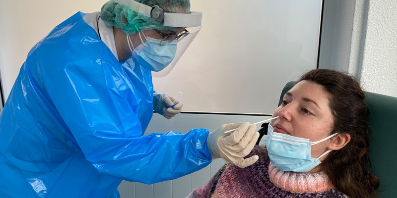 Luzdoc staff doing a COVID-19 test on a patient