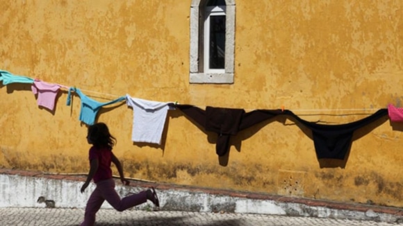 clothes on washing line and child running