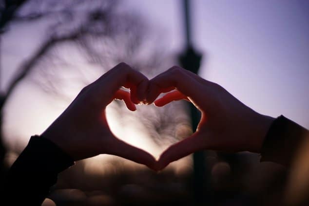hands making the shape of a heart