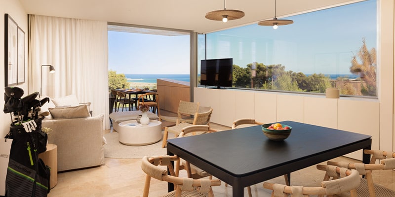 Partial view of the living room and outside area at one of Palmares Signature Apartments|Aerial view of the Palmares Signature Apartments