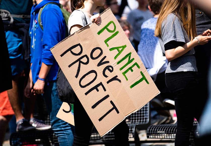 planet over profit sign