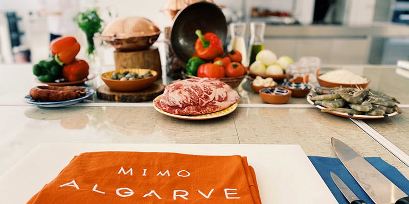 Photo of a counter with several products prepared for the Culinary Experiences at MIMO Algarve||Photos of several bottles of Pine Cliff's new craft beer Falésia