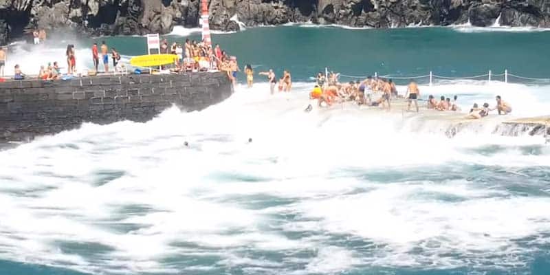 Three injured as monster waves sweep over holiday swimming spot in Azores