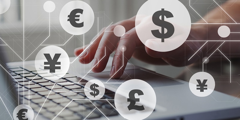 Person typing on laptop keyboard with Euros and Pounds symbols over the image to simbolize the currency exchange business of Privalgo||Man answering cell phone in front of a laptop