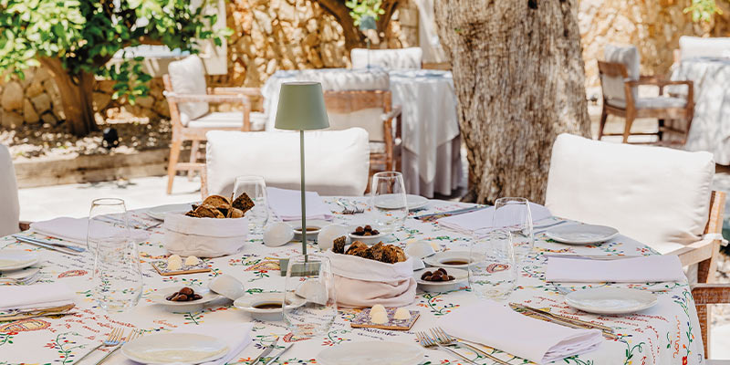 View of a table set on the outside area of the Casa Velha restaurante at Quinta do Lago|qdl_2_aug_2023