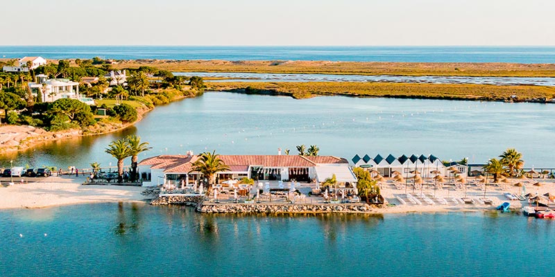 Aerial view of Casa do Lago, a restaurant in Quinta do Lago|Partial view of a meal served at Dano's, one of Quinta do Lago's restaurants