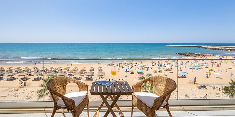 Photo of the beach taken from a balcony in one of the properties in SandyBlue's villa rental portfolio|Photo of one of the villas SandyBlue has for holiday and long-term rentals|Make 2023 the best year for your villa rental strategy!