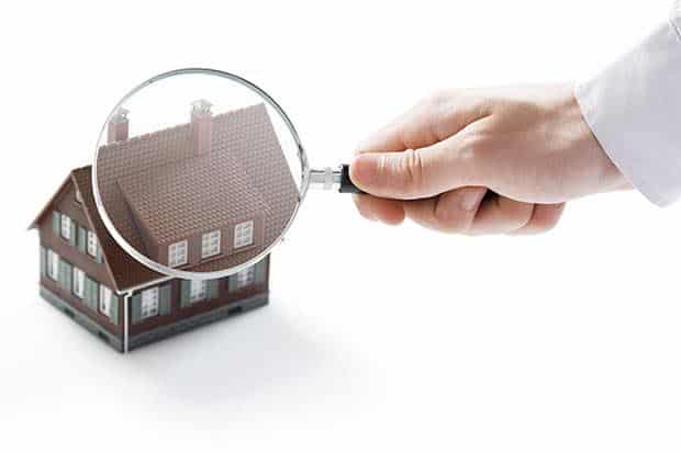 shutterstock_120177004_a-male-hand-holds-a-magnifying-glass-over-a-miniature-house.jpg