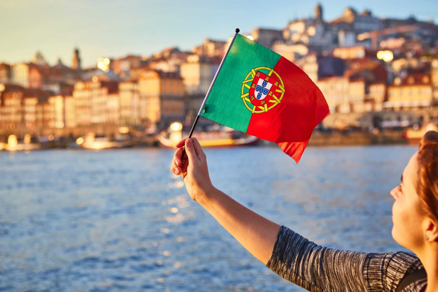 Young,Woman,Tourist,With,Portuguese,Flag,Enjoying,Beautiful,Landscape,View|Prime Minister Luís Montenegro presenting the "Construir Portugal" (Build Portugal) programme last Friday - Photo: Fernando Veludo/LUSA