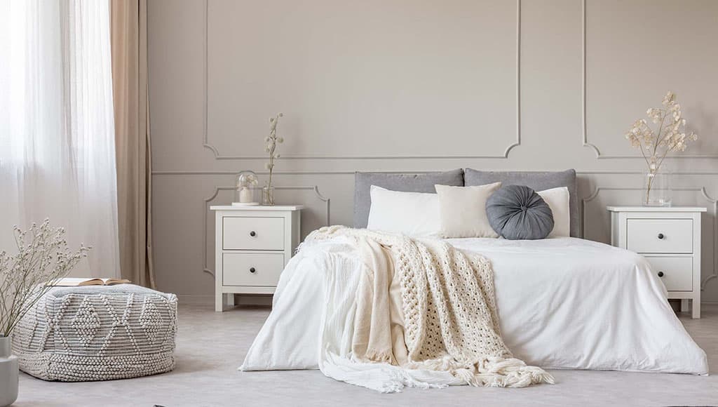 Cozy cream colored woolen blanket on king size bed in bright bedroom|Relaxed pleased fat man in white towel standing isolated on the grey background and smiling with his eyes closed while putting one hand up|Stylish Interior Of Light Bathing Room With Rustic Decorations In Boho Style, Cozy Spacious Bathroom With Natural Green Plants Near Window And Big White Bath Tube Inside, Free Space