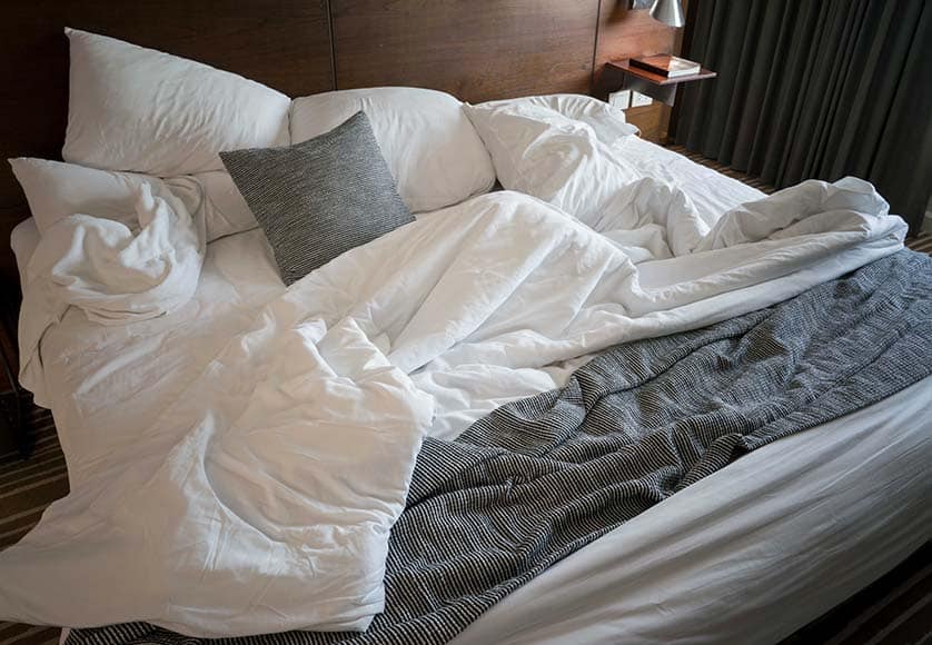 Messy bed in hotel. Image made black and white tone