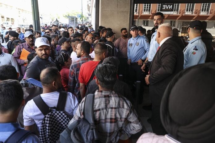 A recent protest outside AIMA offices by migrants desperate for papers/ legalisation. Image: Lusa