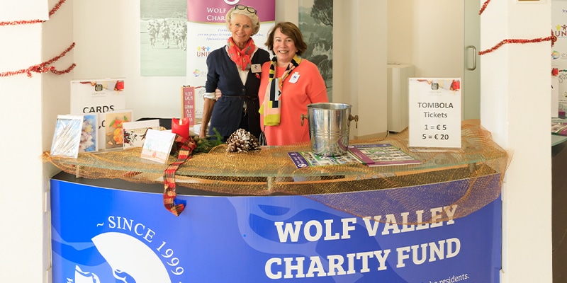 Two representatives of the Wolf Valley Charity Fund at a previous edition of the Vale do Lobo Christmas Market 2021