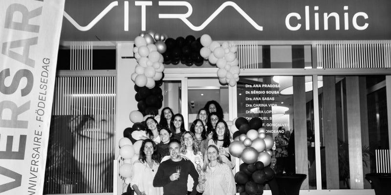 Photo of the staff at the entrance of Vitra Clinic celebrating their first anniversary