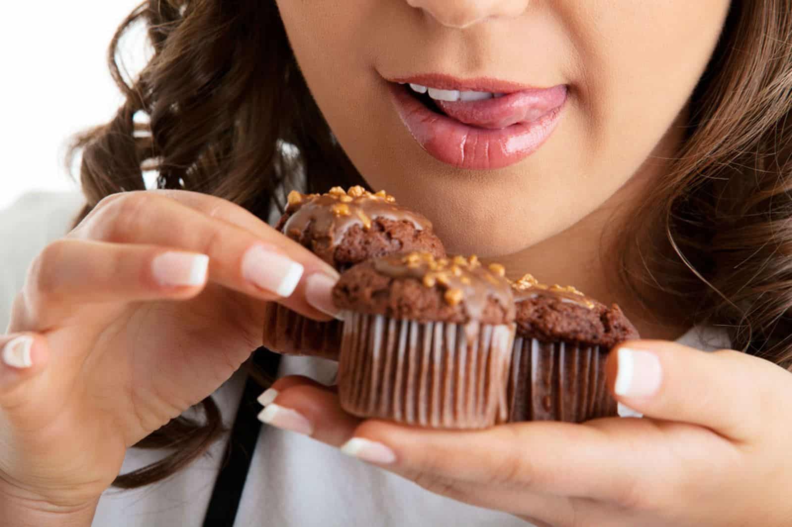 young-woman-with-chocolate-muffin.jpg