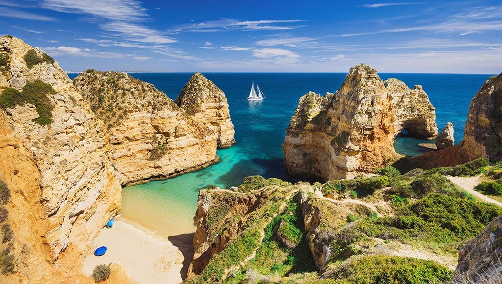 Beautiful bay near Lagos town, Algarve region, Portugal|Portugal - Algarve - Vale do Lobo - Praia Garrao poente|Aerial, aldeia Vale de Lobo, Algarve, Portugal on a sunny day. An ideal city in Europe to spend your holidays.