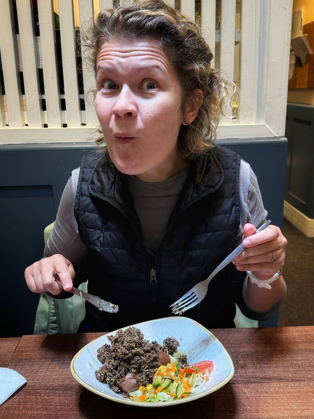 Tucking into a jacket potato stuffed with haggis