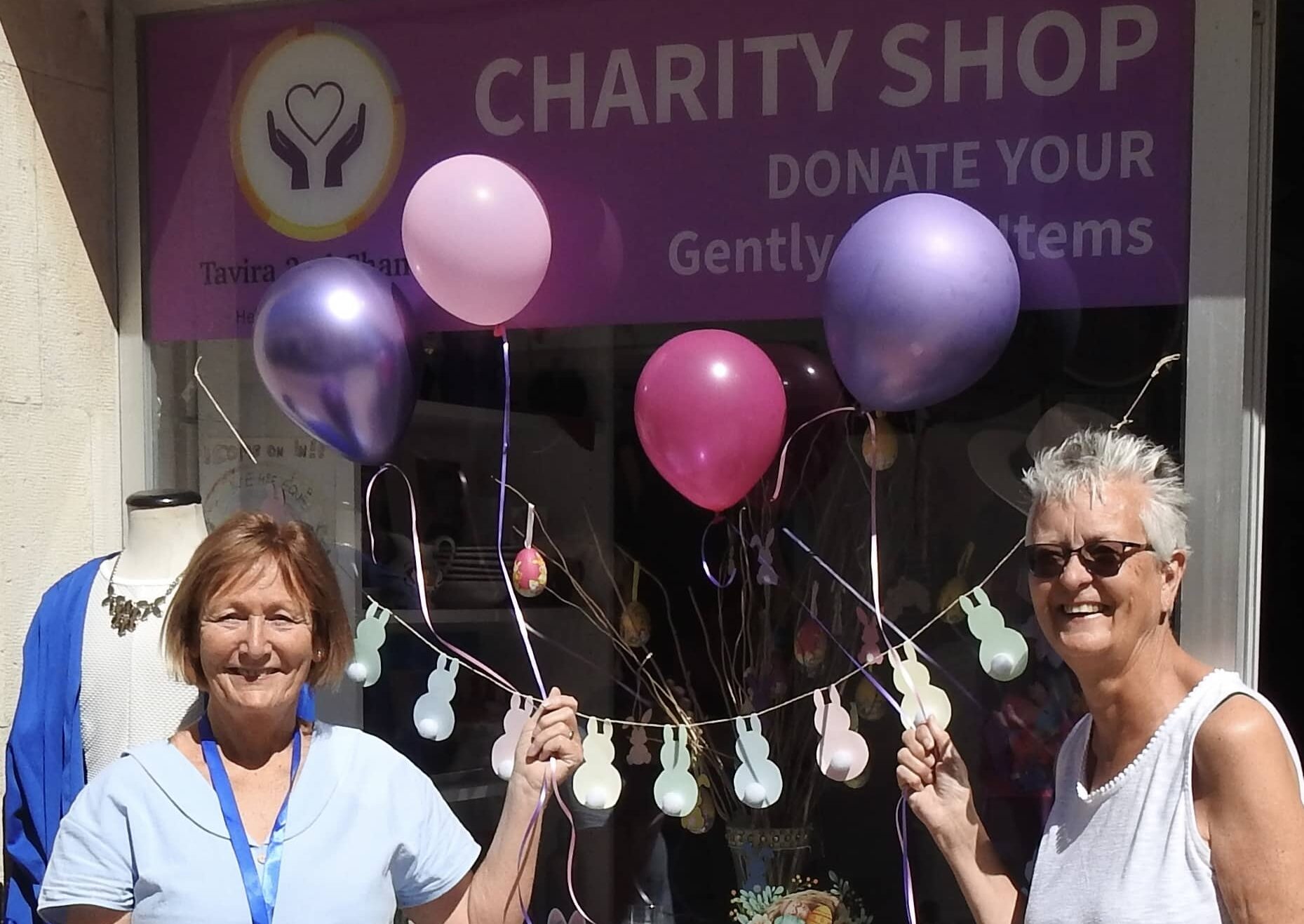 Pauline Bishop (left) and Pam Flood prepare for the Big Balloon Raffle