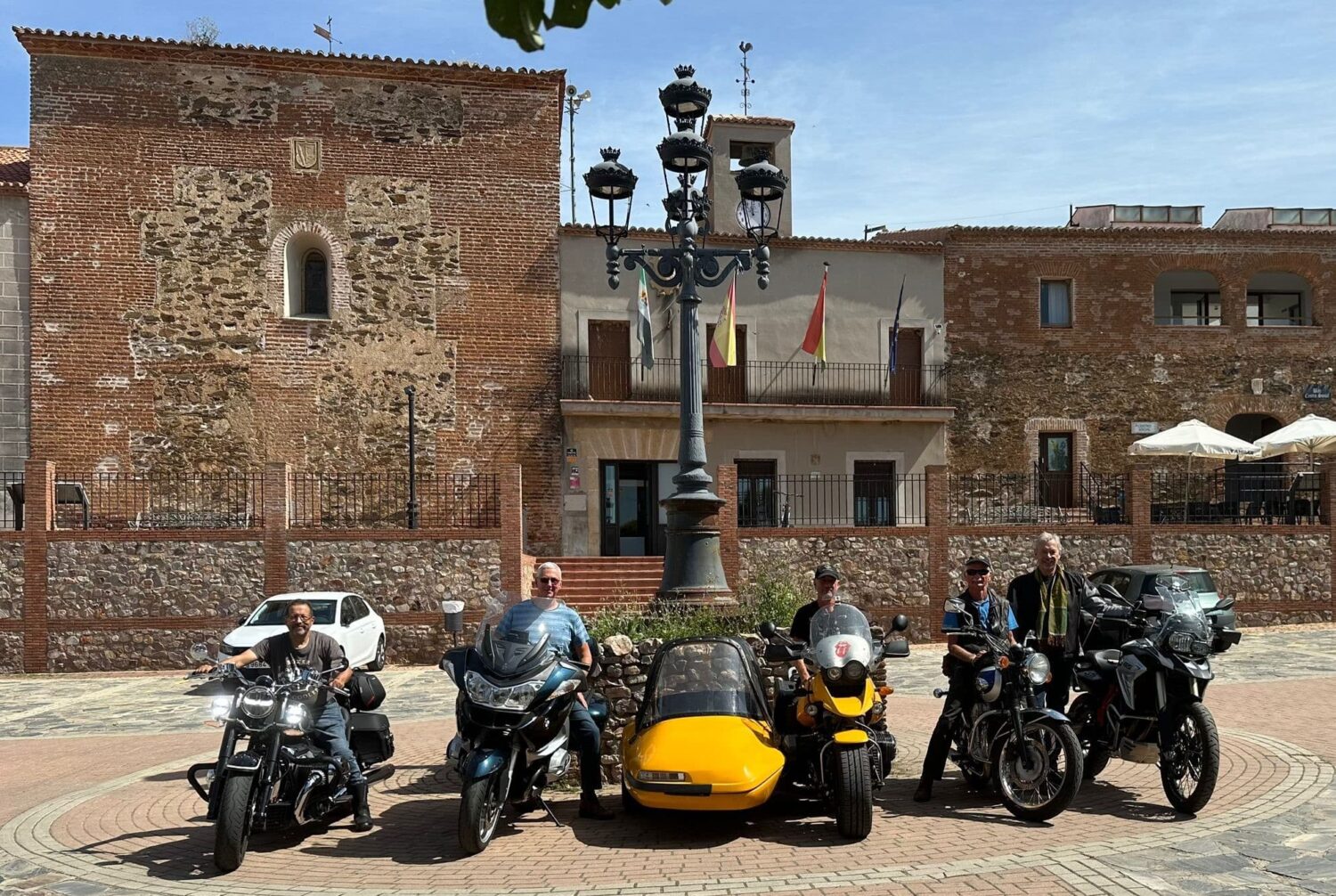ASB riders in the main square of Torrejón el Rubio. From left: Peter, Huw, Tus, Johannes and Walter - Photo: Walter Kollert