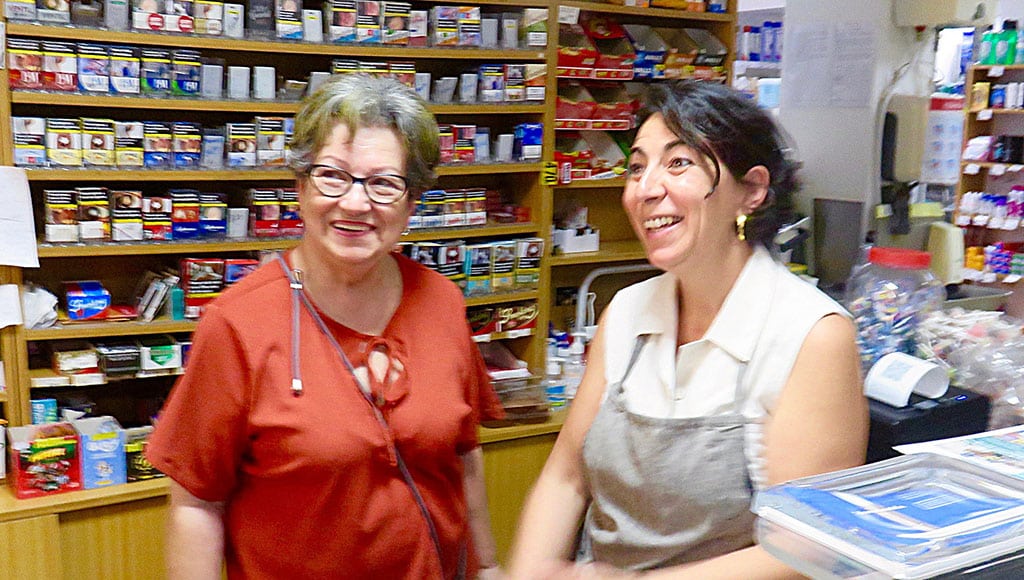 Paulina and Sophia behind the counter at Paulina's corner store. Note the cigarettes for sale behind them, but not to good ol'Pat, at least not any more