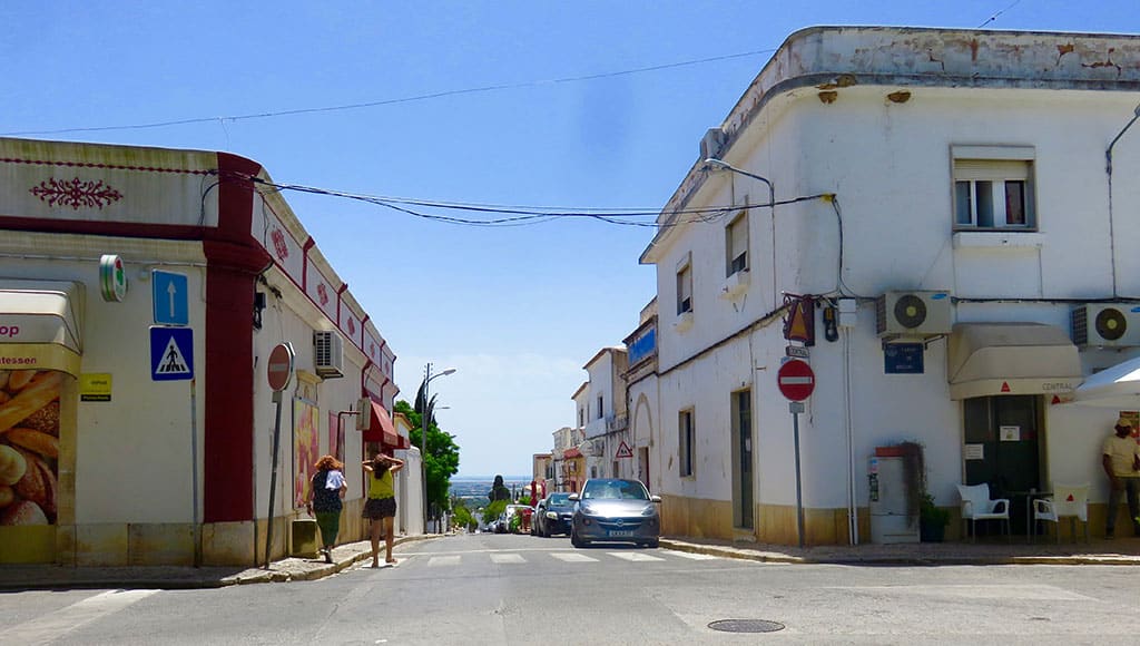 The one-way road coming up from Faro with Paulina's on the left and Café Central on the right