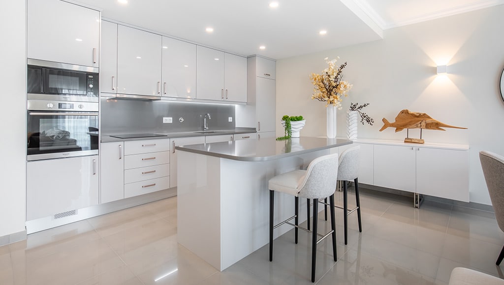 The open-space kitchen and dining area at one of Boavista Golf & Spa resort Bayview Village's property
