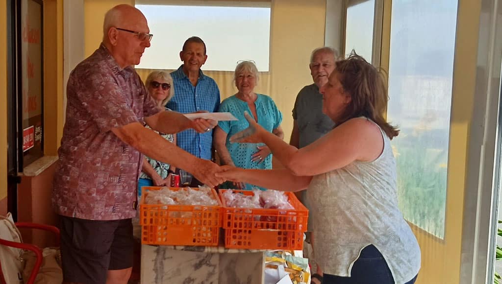 Algarve 41 – Algarve Emporium Charity (Algarve 41 Club Hon. Secretary, Mike Trice presenting Caroline Langston of Algarve Emporium Charity with a cash donation)