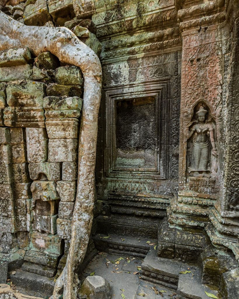 Statues carved into the wall at Ta Prohm