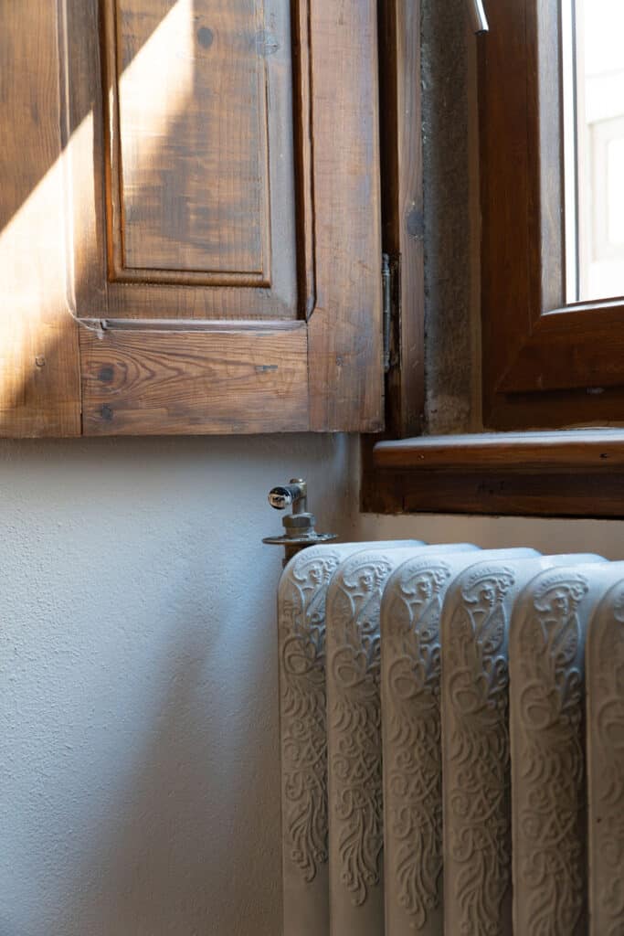 1840s shutters above cast-iron radiators