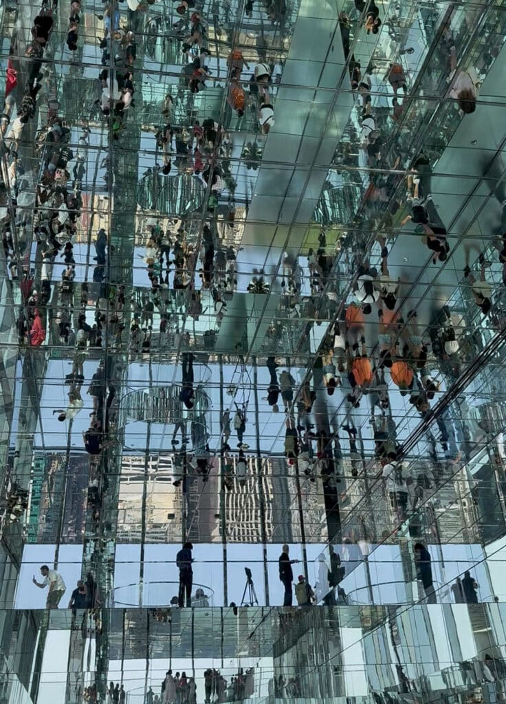 Ceiling mirrors reflecting the visitors