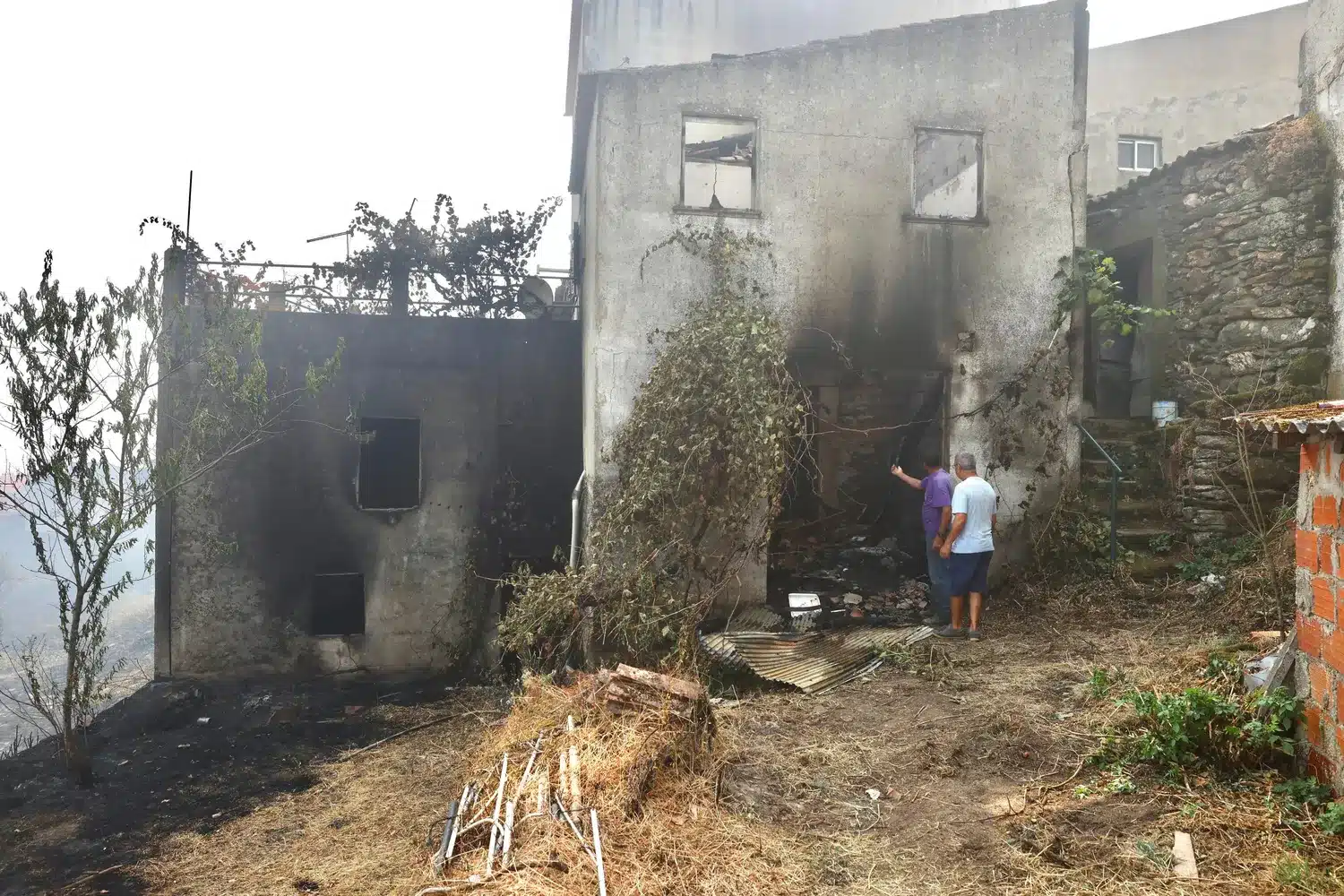 Dozens of properties were destroyed. Mayor Santos does not agree with government refusing to help emigrés rebuild