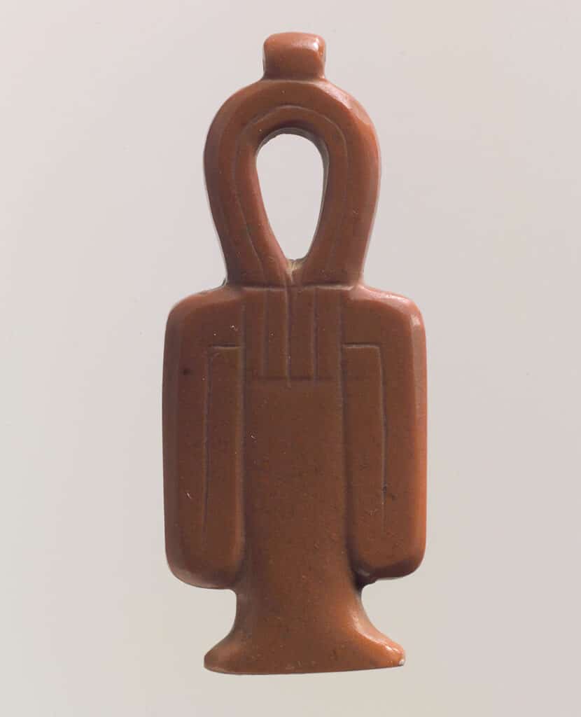 A Tyet amulet, also known as the Knot of Isis