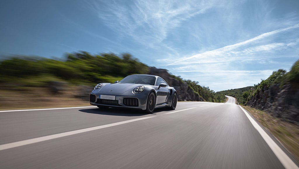 A Porsche automobile on a road
