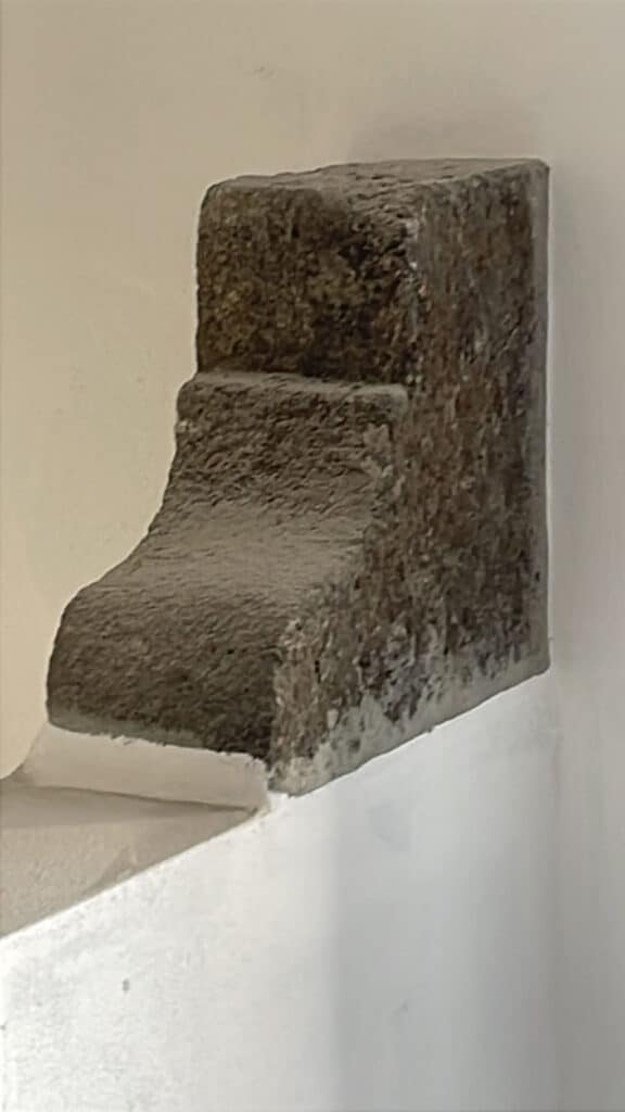 16th-century corbel feature - was being used as a garden step