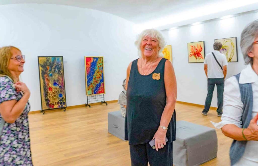 Artist Jean Davis in her exhibition at Jali
