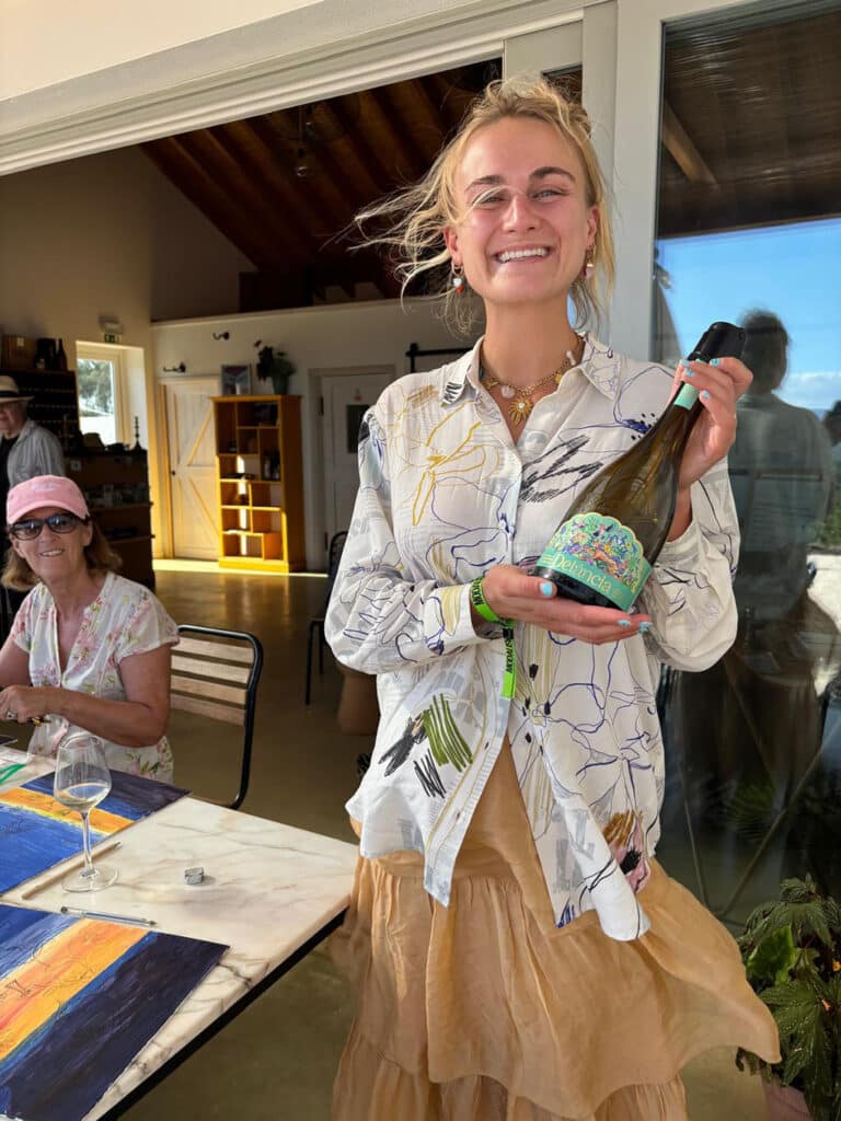 Wine time: Inès Deroche presenting Delância wine to the artists