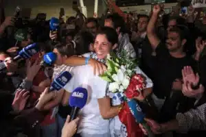 Thousands invade arrivals hall to welcome home flotilla detainees