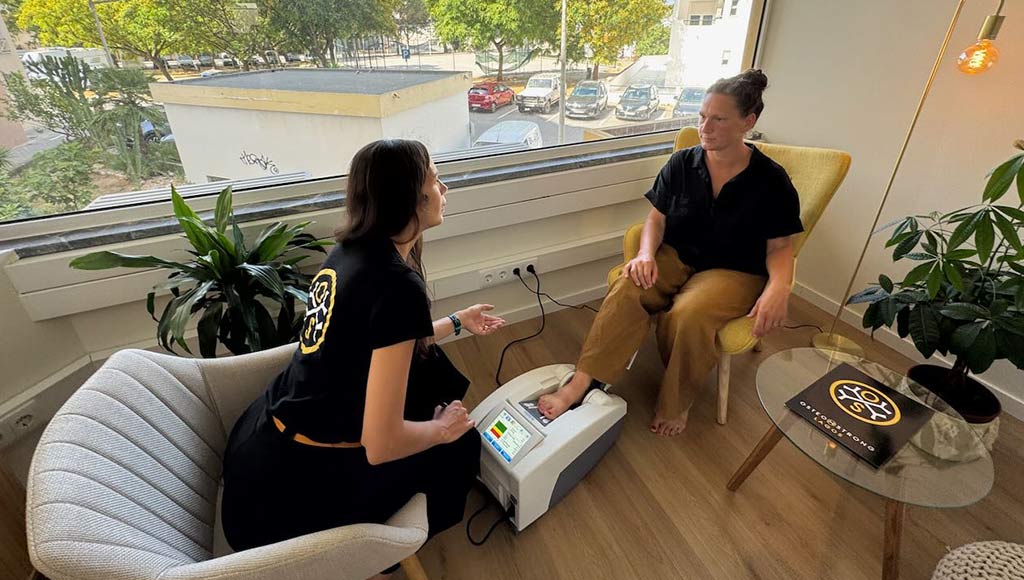 A woman doing her initial assessment at OsteoStrong in Lagosequipment in Lagos
