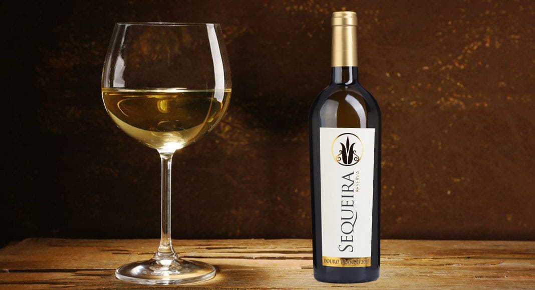 Goblet of white wine on wooden table on wooden wall background. Fotalia