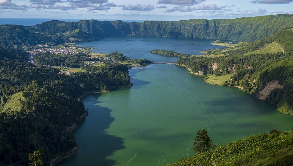 Fly from Faro to the Azores main island of São Miguel and visit sites as majestic as the twin crater lakes of Sete Cidades