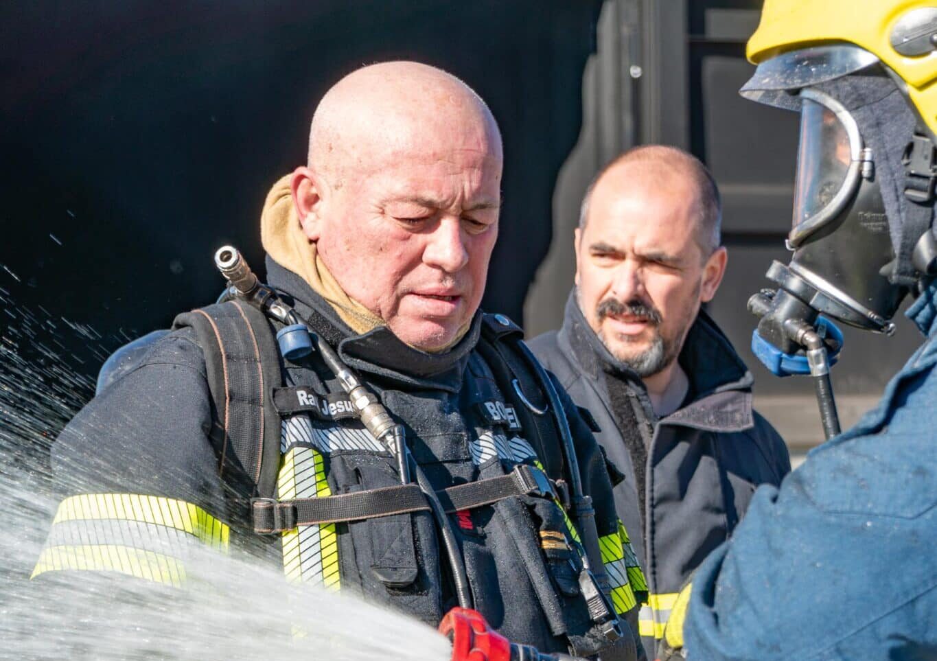 Fire Chief Raul Manuel Lourenço de Jesus (left) trains volunteers